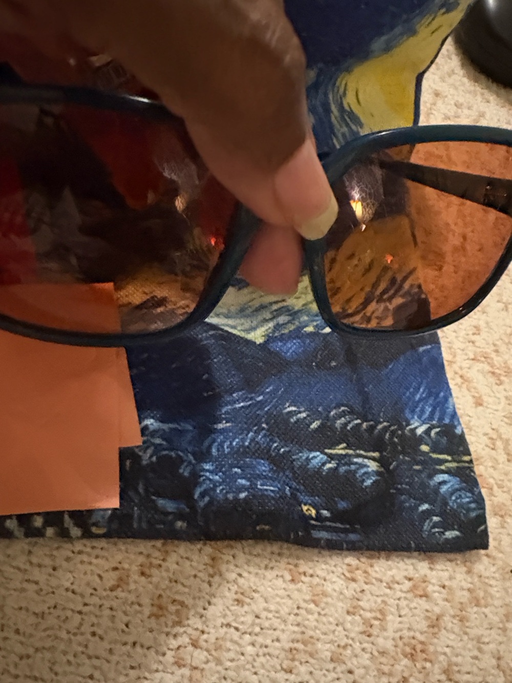 Max & Co. red pouch with teal sunglasses and brown lenses